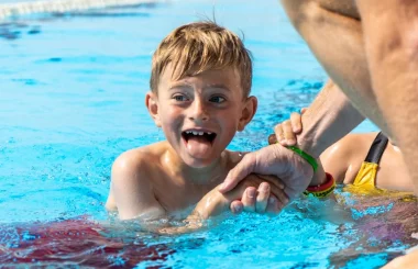 A child participating in the swim camp