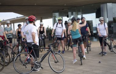 Participants standing with their bikes