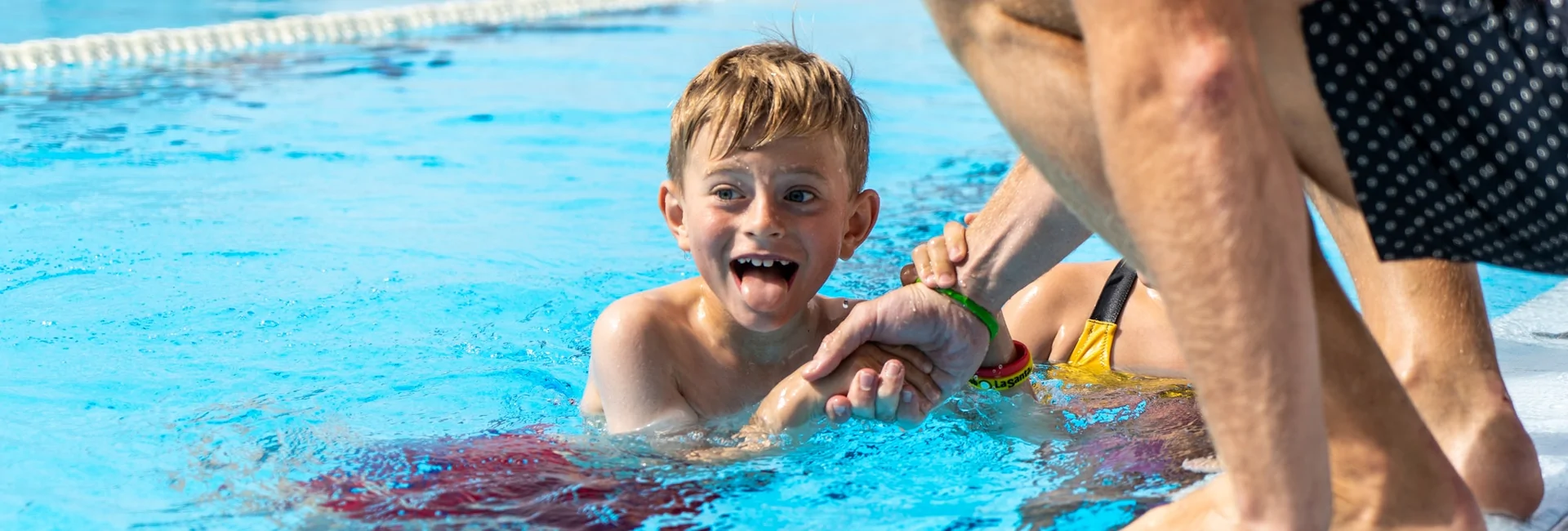 A child participating in the swim camp