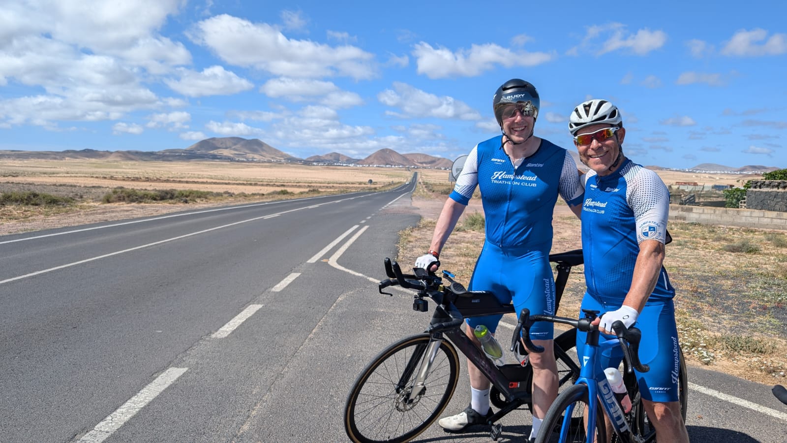 Two of the triathlon camp members posing with their bikes in Lanzarote