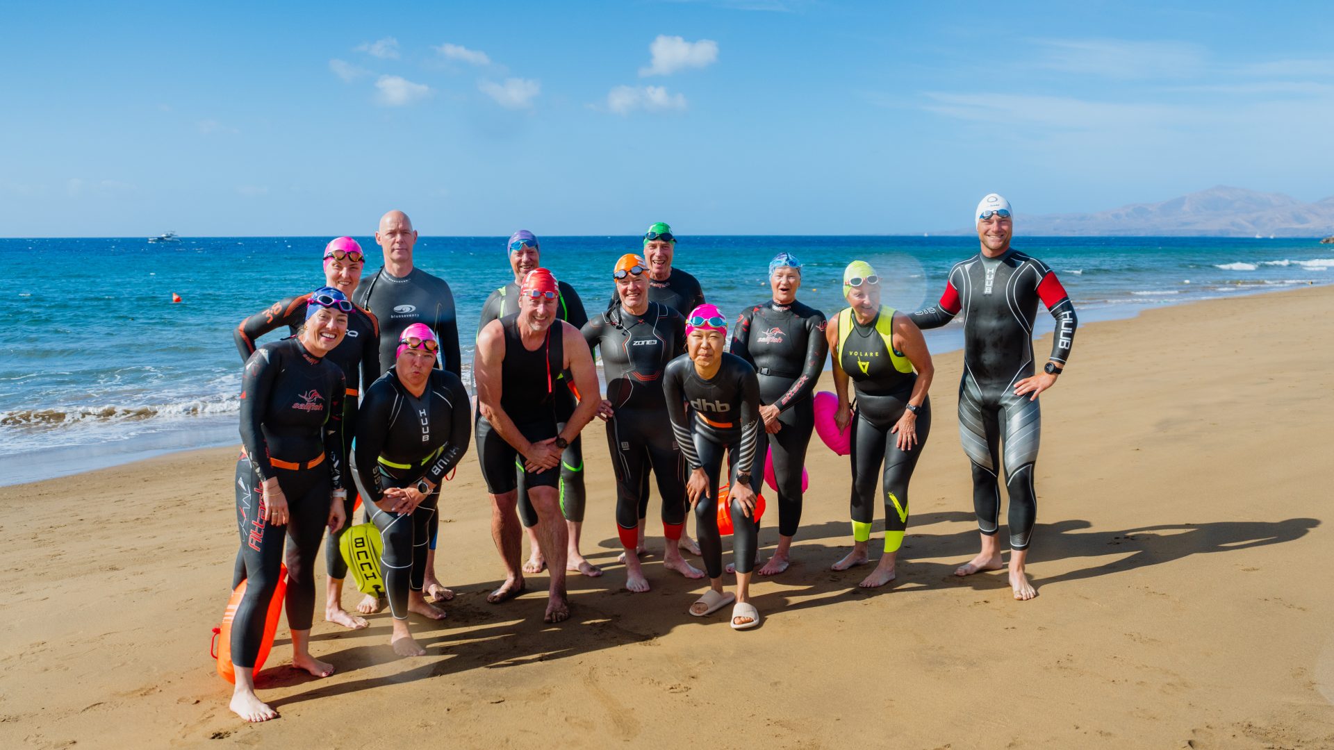 Dan Bullock's open water swim camp posing for a group picture at the Club La Santa Lagoon